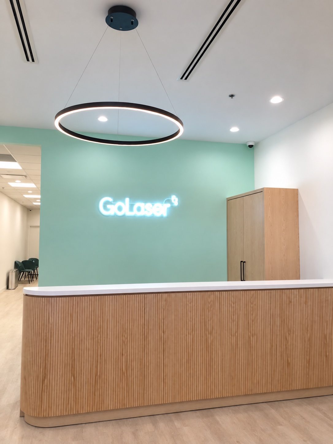 Clinic reception desk with a wood front built by Leewood Finishing