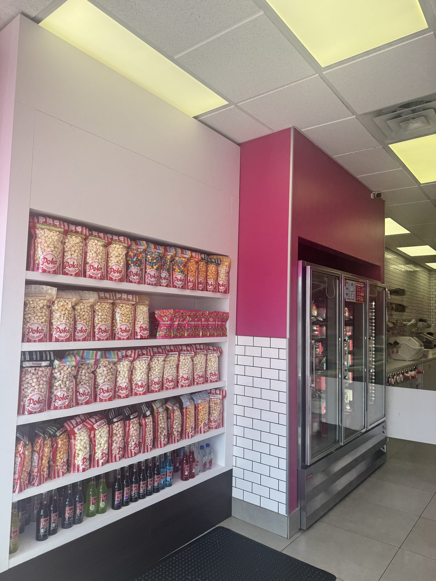 Open shelving wall in an Oakville ice cream shop built by Leewood Finishing