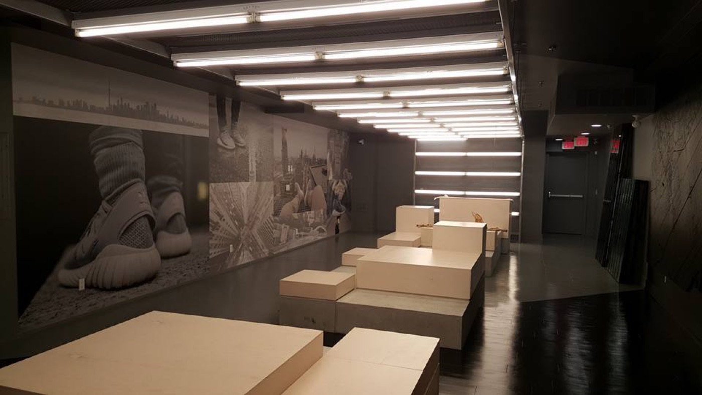 Adidas retail store with custom millwork display fixtures and branded shelving built by Leewood Finishing