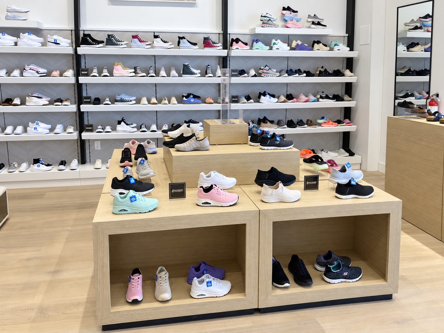 Wood display tables for footwear, built by Leewood Finishing