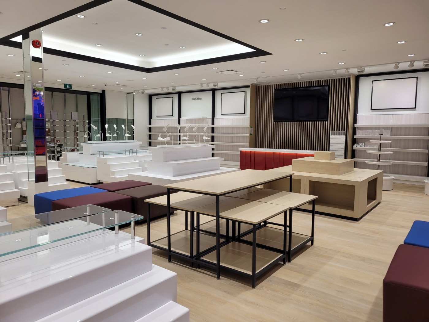Softmoc Lyndon Park — full retail environment built by Leewood Finishing showing custom display fixtures, slatted wood feature wall, and bespoke millwork throughout